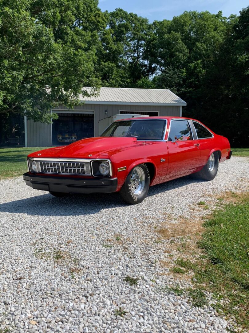 A Red Color Nova With Five Inch Bolt on Hood